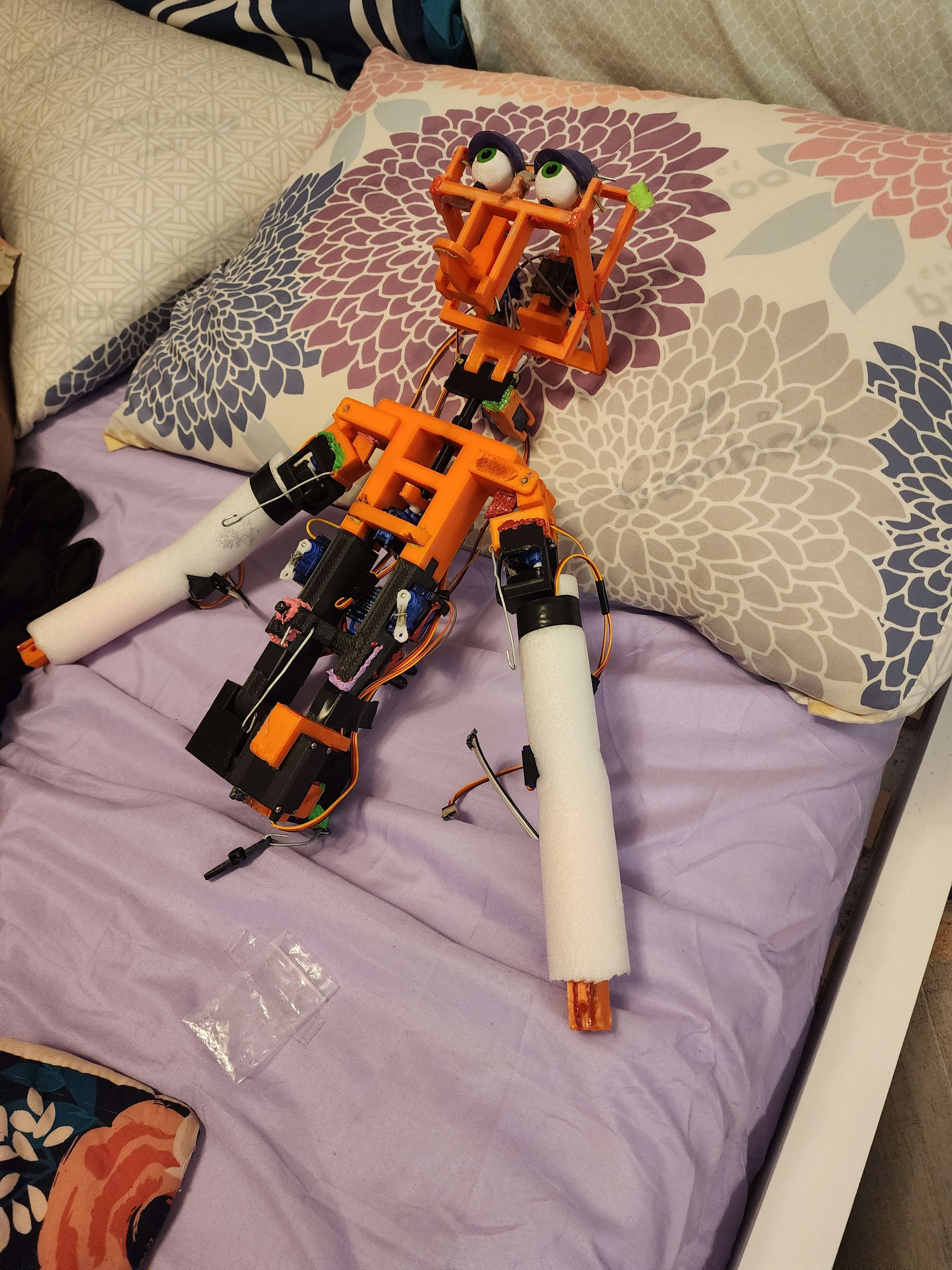 mitzi's mech laying in my bed